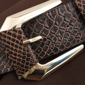 Brown snake print leather belt with gold polygonal buckle shown in close-up detail