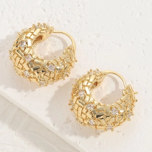 14K gold plated geometric hoop earrings with sparkling zircon stones on stone surface