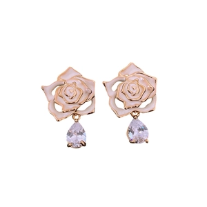 Vintage enamel flower earrings with gold frame and teardrop zircon pendant on white background