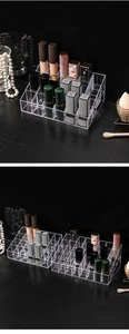 Macro view of transparent acrylic lipstick organizer with dustproof slots on wood