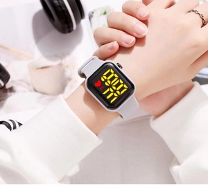 Wrist view of a grey silicone LED digital watch with square screen for daily activities