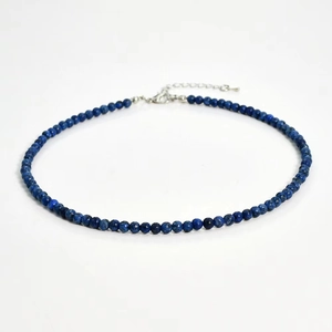 Close-up of 4mm dark blue natural stone beaded necklace with silver lobster clasp and chain