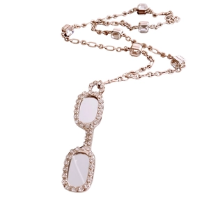 Rose gold glasses pendant necklace with sparkling cubic zirconia on white background