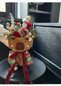 Detail of Christmas plush bear container with roses, pine branches and red velvet ribbons