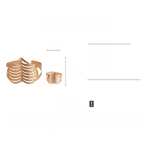 Detail view of rose gold hollow textured metal cuff bracelet and open ring set for women