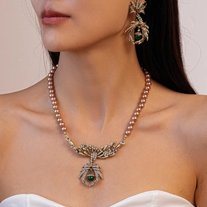 Vintage necklace and earrings set with bronze pearls and green gemstone pendants