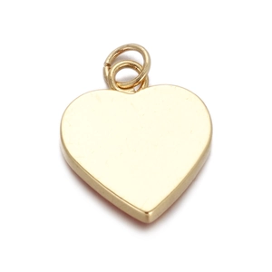 Close-up of golden heart pendant with a smooth metallic finish for jewelry making