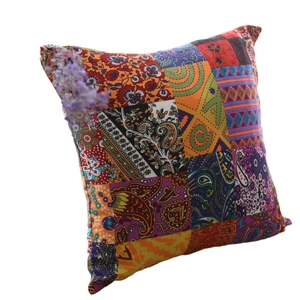 Bohemian paisley linen pillow cover with vibrant patterns and decorative tassels