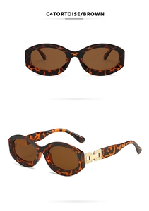 Macro view of leopard print oval frame sunglasses with golden metal hinges and brown lens