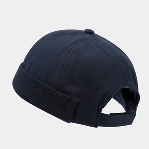 Navy blue docker cap with adjustable strap and six-panel crown for men and women