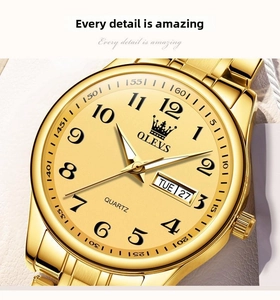 Detail shot of OLEVS gold steel watch face showing date and day display and quartz movement