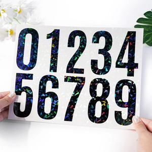 Detail view of 4-inch holographic vinyl number stickers 0-9 with shattered glass pattern