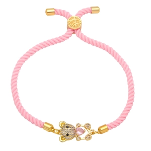 Handmade woven pink rope bracelet with a gold teddy bear charm and pink heart crystal