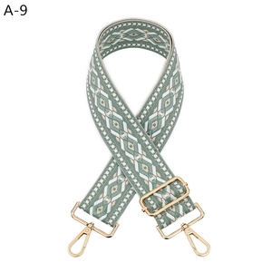 Detail of adjustable geometric weave strap with high-quality gold metal clasps
