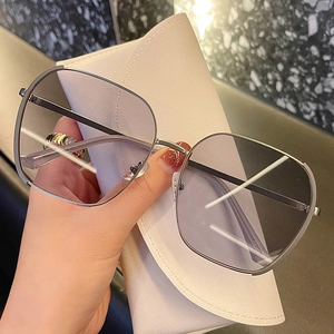 Chic oversized polygonal silver metal sunglasses with grey gradient lenses and leather case