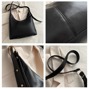 Detailed views of black PU leather hobo bag with gold ring hardware and stitching