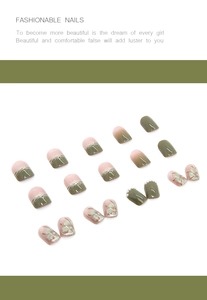 Detail of camellia press-on nails featuring pink and green gradients with pearl accents