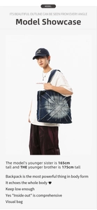 Detailed close-up of dark denim tote bag with deconstructed patchwork and frayed edges