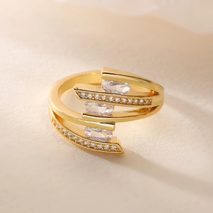 Detail of 18K gold-plated geometric multi-layer ring featuring clear zircon stones