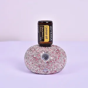 Close-up of luxury rhinestone aroma diffuser with pink crystals for 15ml essential oil