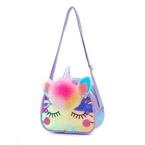 Detail of purple iridescent unicorn crossbody bag with colorful pom poms and cute eyes