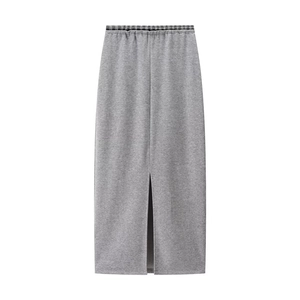 Detailed view of grey midi skirt featuring elastic plaid waistband and high front slit