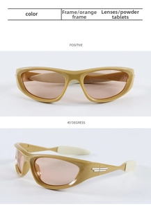 Detail of orange sports sunglasses with pink lenses and silver wing decoration on the side