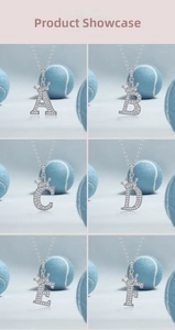 Macro shot of 925 silver crown initial pendants A-F with shimmering moissanite inlay