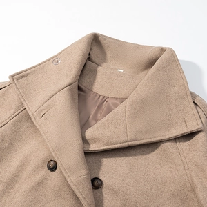 Detail of camel wool coat lapel with dark brown buttons and soft fabric texture