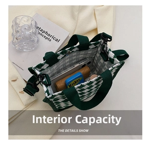 Internal capacity of green quilted tote bag showing phone, card holder and small items