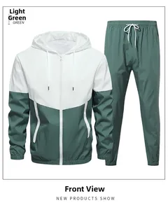 Detail of color-block hooded sports jacket with zipper and matching jogger pants set
