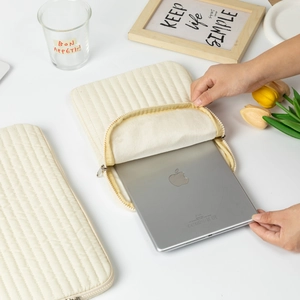 Padded cream quilted laptop sleeve for iPad with soft lining and zipper closure
