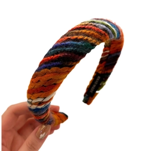 Handmade chunky knit headband with colorful wool braid and high top vintage design