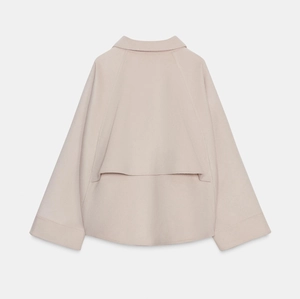 Women's minimalist oatmeal wool blend zip jacket featuring back storm flap detail