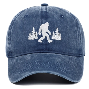 Vintage washed blue denim baseball cap featuring white Bigfoot and pine trees embroidery