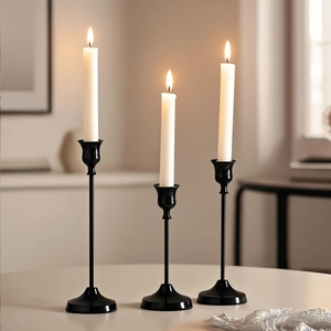 Three-piece black polished metal candle holder set for elegant European dining decor