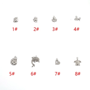 DIY stainless steel animal pendants set including dinosaur, unicorn and seashell designs