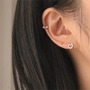 925 silver bow zircon earrings and gold heart stud set shown on model ear