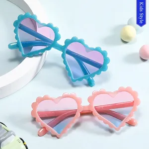 Glitter heart-shaped kids sunglasses with scalloped edges and gradient lenses