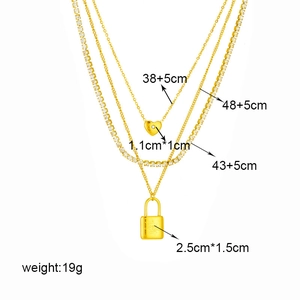 Three-layer gold titanium steel necklace featuring heart and lock pendants with crystals
