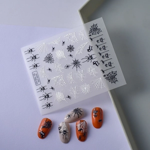 5D embossed spider web nail art stickers with white and black Halloween patterns