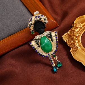 Vintage exotic tribal chief portrait brooch with pearls, green gems, and rhinestones