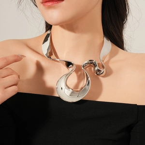 Close-up of irregular wave silver choker with polished metallic texture on model
