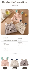 Detail view of coral fleece hair drying towel with rabbit ear design and size specifications