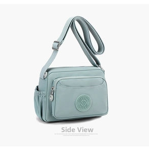 Detailed side view of water-resistant nylon shoulder bag with zip pockets and logo