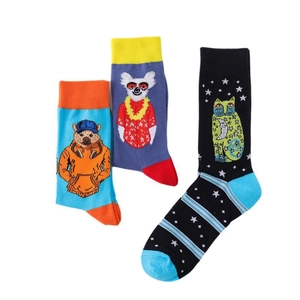 Detail of colorful cartoon bear and alpaca pattern knitted crew socks on white background