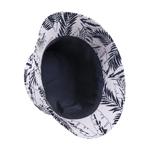 Wide brim bucket hat with tropical maple leaf print and black lining for sun protection