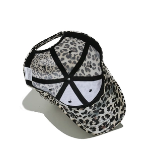 Detailed view of leopard print baseball cap interior with quality stitching and strap