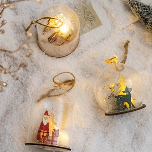 Nordic glowing Christmas glass bauble with LED light and festive tree ornaments