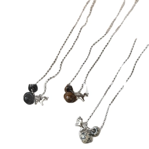 Tiger eye and stone puppy pendant necklaces in black, brown, and spotted white sets